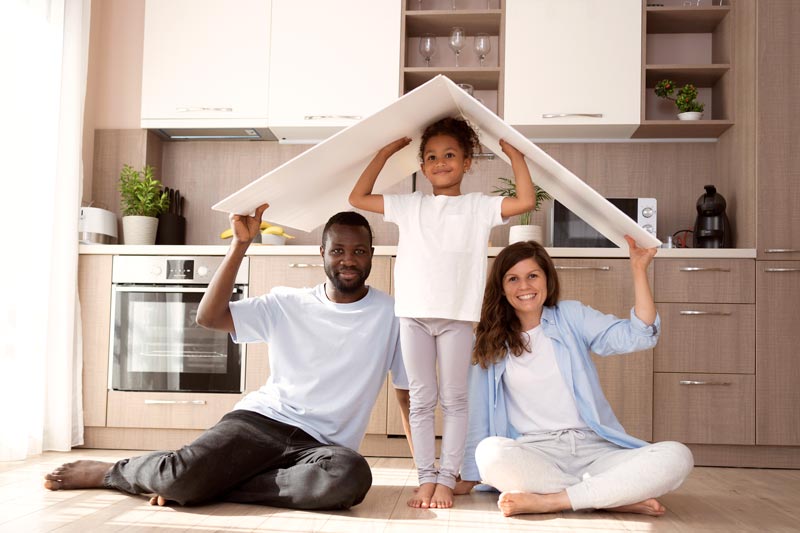 Cute family holding roof their head